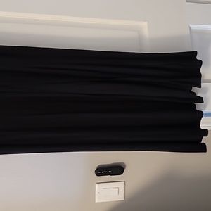 Long black shirt to the bottom of my ankles, front opening down the leg.